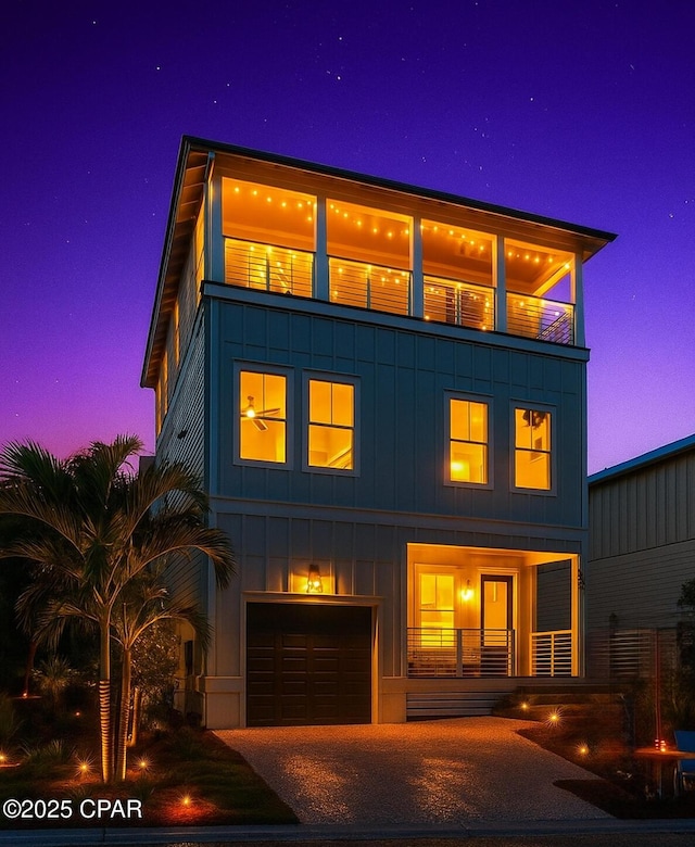 150 Grande Pointe Cir, Inlet Beach, FL 32461 - view of front of home featuring an attached garage, board and batten siding, and driveway
