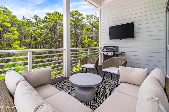 balcony with outdoor lounge area and grilling area