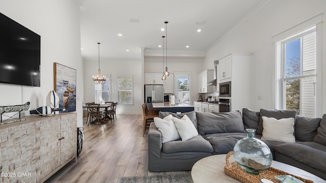 150 Grande Pointe Cir, Inlet Beach, FL 32461 - living area with a chandelier, light wood-type flooring, ornamental molding, and recessed lighting
