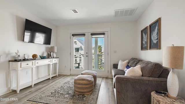 150 Grande Pointe Cir, Inlet Beach, FL 32461 - living area featuring light wood-style flooring and french doors