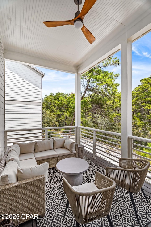 150 Grande Pointe Cir, Inlet Beach, FL 32461 - sunroom with a ceiling fan, an outdoor living space, and view of scattered trees