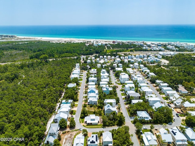 bird's eye view with a residential view and a water view