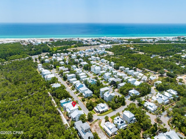 drone / aerial view featuring a residential view and a water view