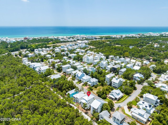 drone / aerial view featuring a water view and a residential view