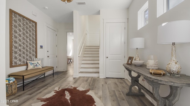 150 Grande Pointe Cir, Inlet Beach, FL 32461 - entrance foyer with wood finished floors and stairs