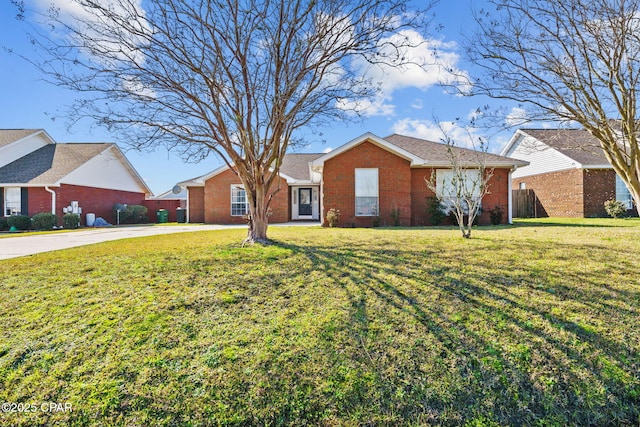 view of front of home with brick siding and a front lawn