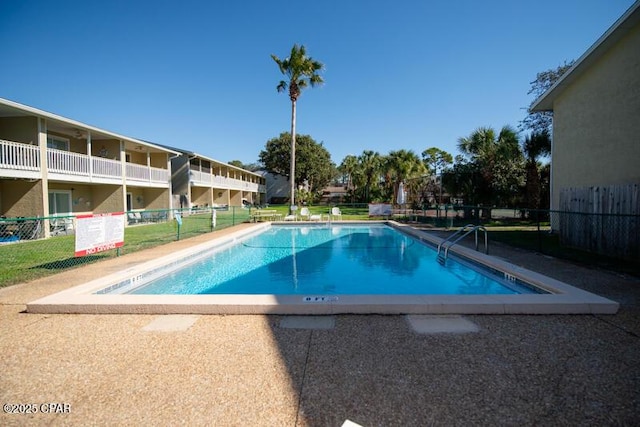 community pool featuring fence