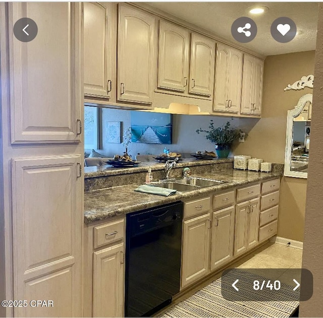 kitchen featuring light tile patterned floors, black dishwasher, baseboards, dark countertops, and a sink