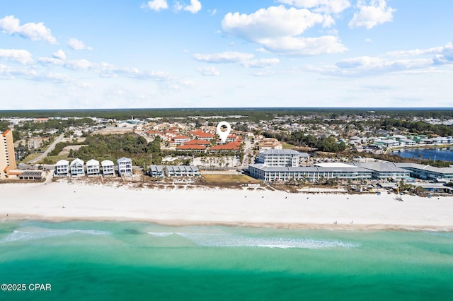 drone / aerial view featuring a water view and a beach view