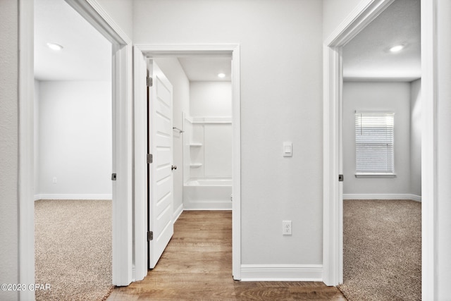 hall featuring recessed lighting, baseboards, and carpet floors