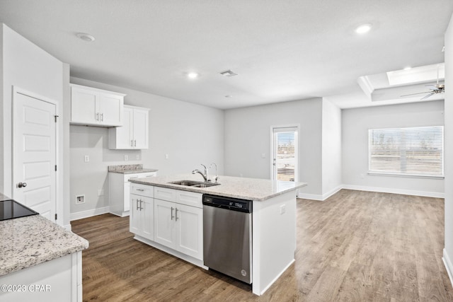 kitchen with visible vents, dishwasher, light wood-style floors, white cabinets, and a sink