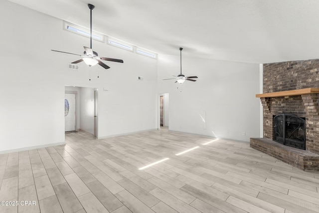 7577 Kelsey Dr, Panama City, FL 32404 - unfurnished living room with visible vents, light wood-type flooring, a fireplace, and a ceiling fan