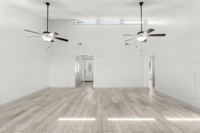7577 Kelsey Dr, Panama City, FL 32404 - unfurnished living room with wood finish floors, visible vents, and a ceiling fan