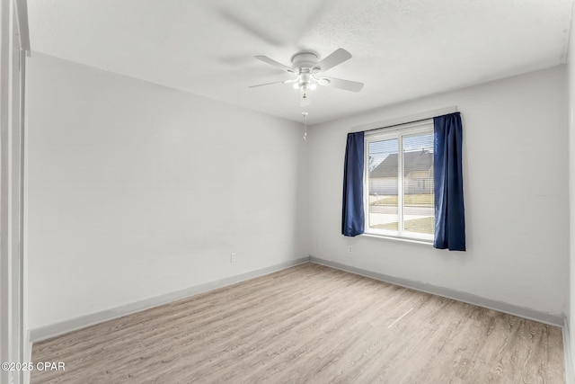 7577 Kelsey Dr, Panama City, FL 32404 - unfurnished room with wood finished floors, a ceiling fan, and baseboards
