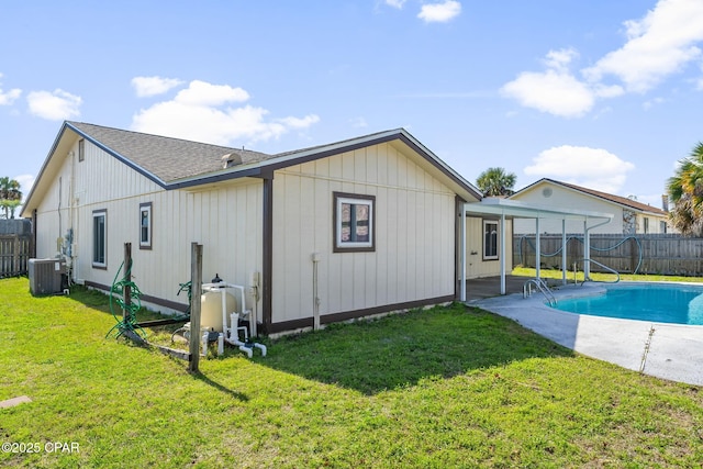 7577 Kelsey Dr, Panama City, FL 32404 - rear view of house featuring central AC, a lawn, a patio, and a fenced backyard