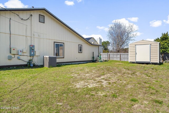 7577 Kelsey Dr, Panama City, FL 32404 - view of yard featuring a storage shed, an outdoor structure, fence, and central air condition unit
