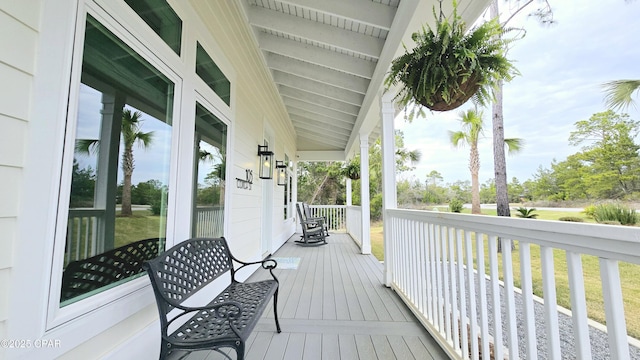 wooden terrace with a porch