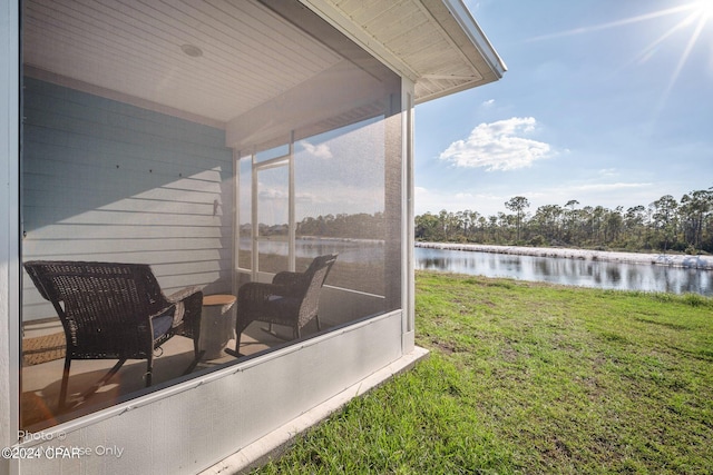 exterior space with a water view and a healthy amount of sunlight