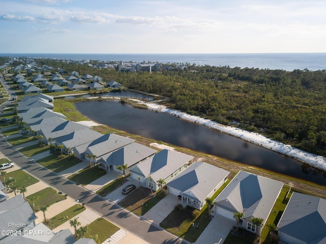 birds eye view of property featuring a water view and a residential view