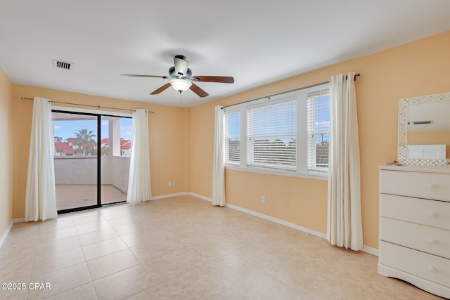 8730 Thomas Dr Unit 1201-B, Panama City Beach, FL 32408 - spare room with light tile patterned flooring, a ceiling fan, visible vents, and baseboards