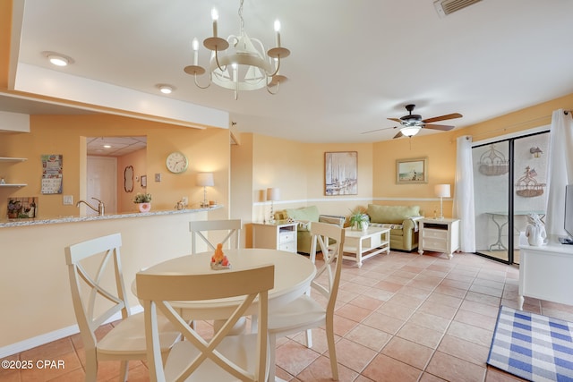8730 Thomas Dr Unit 1201-B, Panama City Beach, FL 32408 - dining room with light tile patterned flooring, visible vents, and ceiling fan with notable chandelier