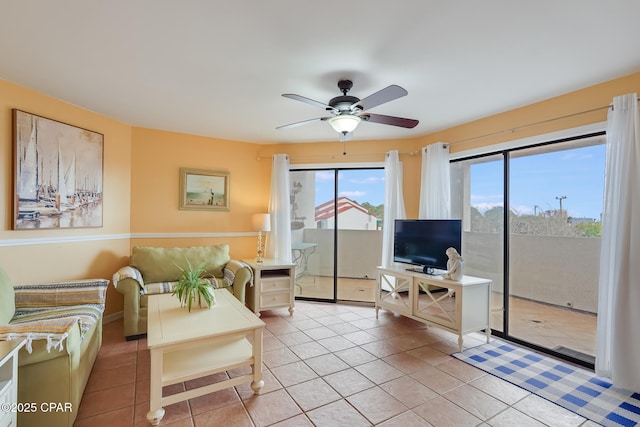 8730 Thomas Dr Unit 1201-B, Panama City Beach, FL 32408 - living room featuring light tile patterned flooring and a ceiling fan