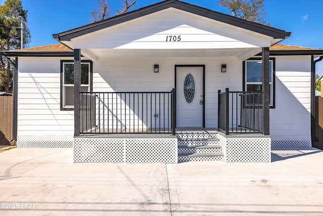 1705 Lake Ave, Panama City, FL 32401 - view of front of home with a porch and a shingled roof