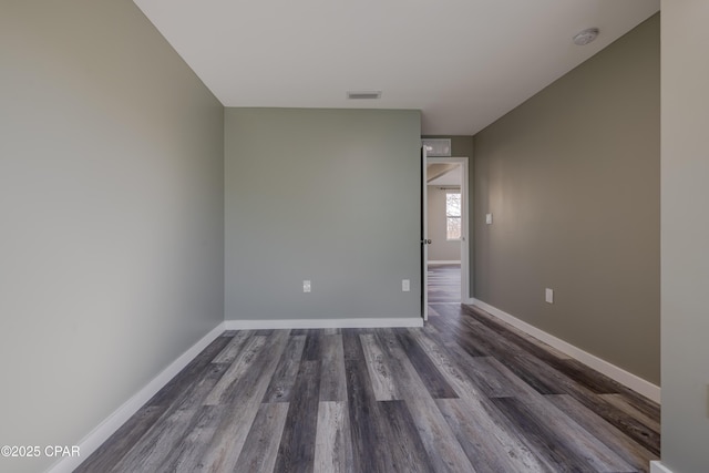 1705 Lake Ave, Panama City, FL 32401 - unfurnished room with dark wood-style floors, baseboards, and a smoke detector