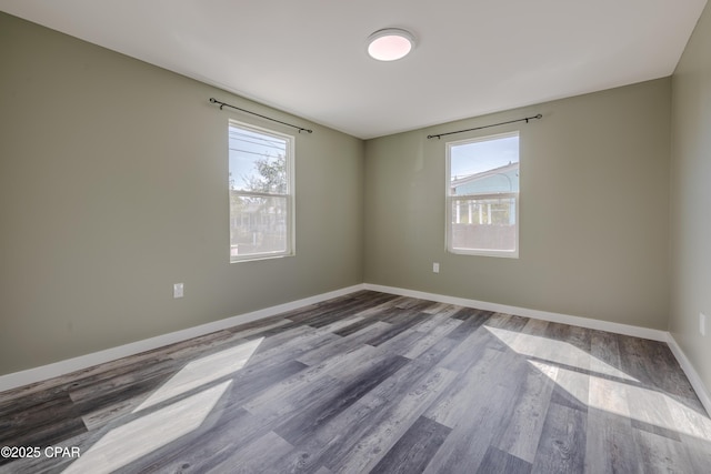 1705 Lake Ave, Panama City, FL 32401 - spare room featuring healthy amount of natural light and wood finished floors