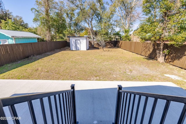 1705 Lake Ave, Panama City, FL 32401 - view of yard featuring a storage shed, a patio, and an outbuilding