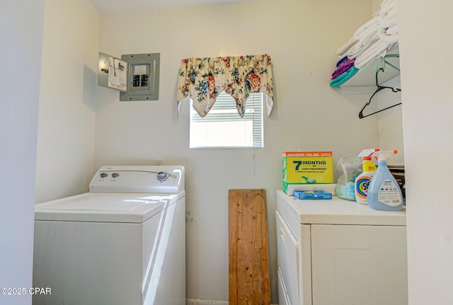 washroom featuring laundry area, electric panel, and independent washer and dryer