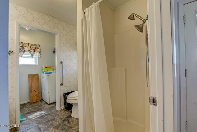 full bathroom featuring washer / clothes dryer, a stall shower, and wallpapered walls