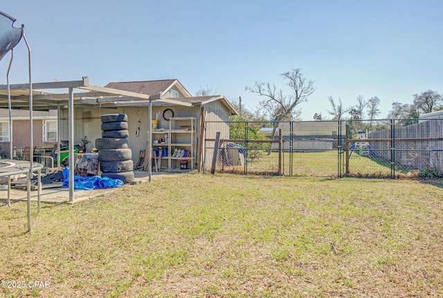 view of yard with a gate, fence, and a pergola