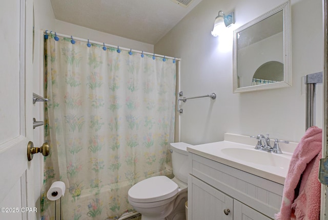 full bathroom featuring shower / bath combo with shower curtain, vanity, and toilet