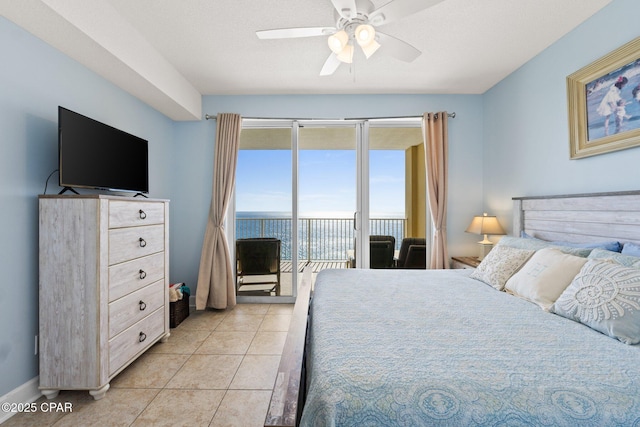 bedroom featuring access to outside, light tile patterned flooring, and a ceiling fan