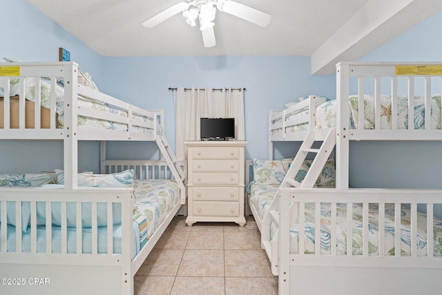 bedroom featuring tile patterned floors and a ceiling fan