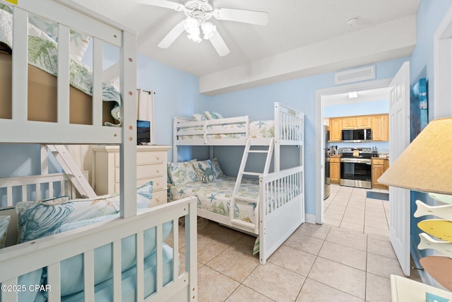 bedroom featuring light tile patterned floors, visible vents, and ceiling fan