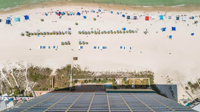 drone / aerial view featuring a view of the beach and a water view