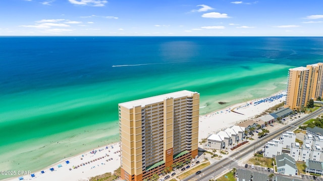 bird's eye view with a city view, a view of the beach, and a water view