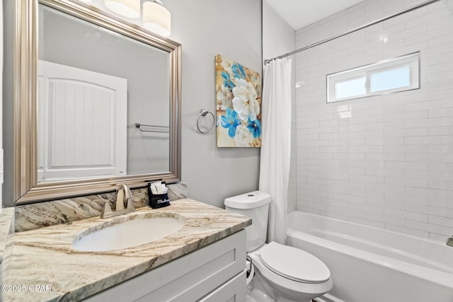 full bathroom featuring toilet, vanity, and shower / tub combo with curtain