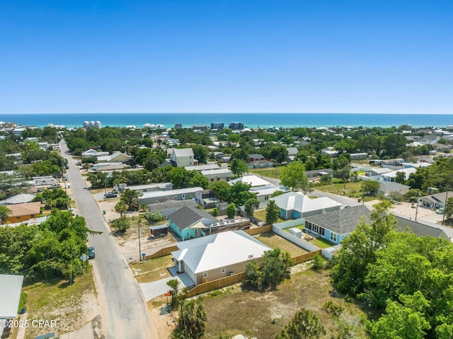 birds eye view of property featuring a water view and a residential view