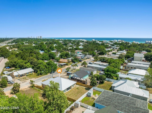 birds eye view of property with a residential view and a water view