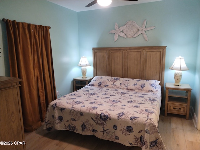 bedroom featuring light wood-style floors and a ceiling fan