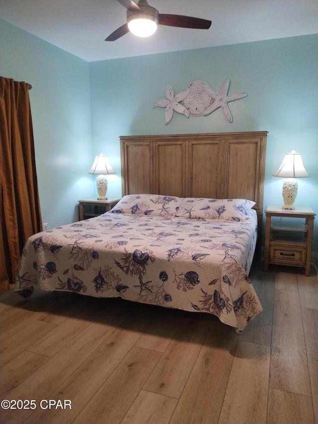 bedroom with ceiling fan and light wood-style floors