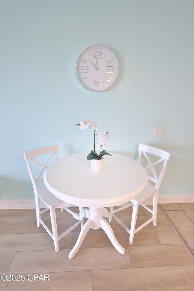 tiled dining area with baseboards