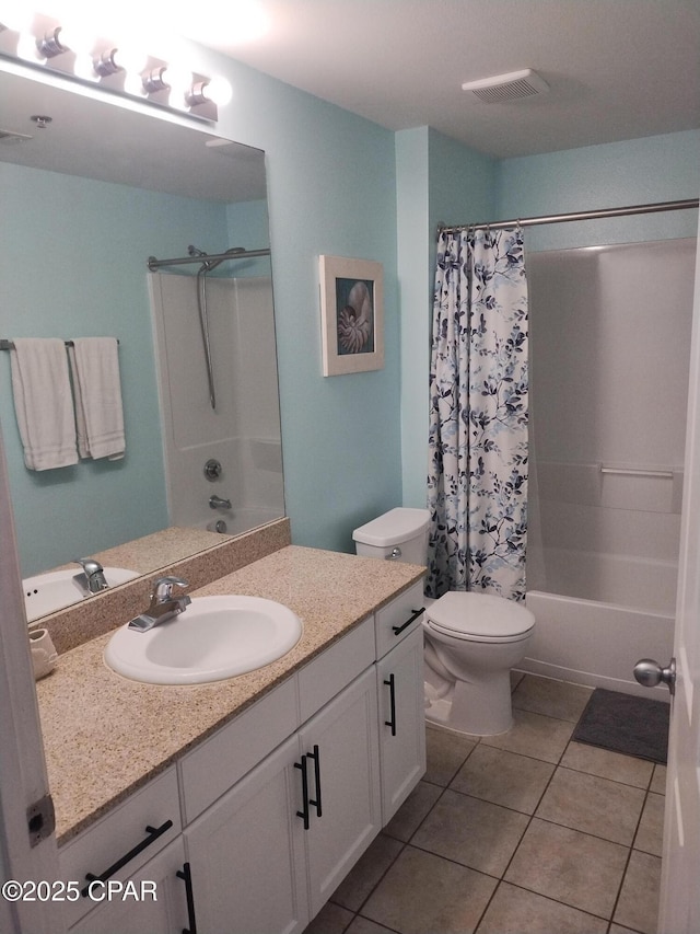 bathroom with visible vents, toilet, shower / bath combo with shower curtain, vanity, and tile patterned floors