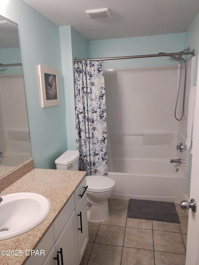 bathroom featuring visible vents, toilet, tile patterned floors, shower / bath combination with curtain, and vanity