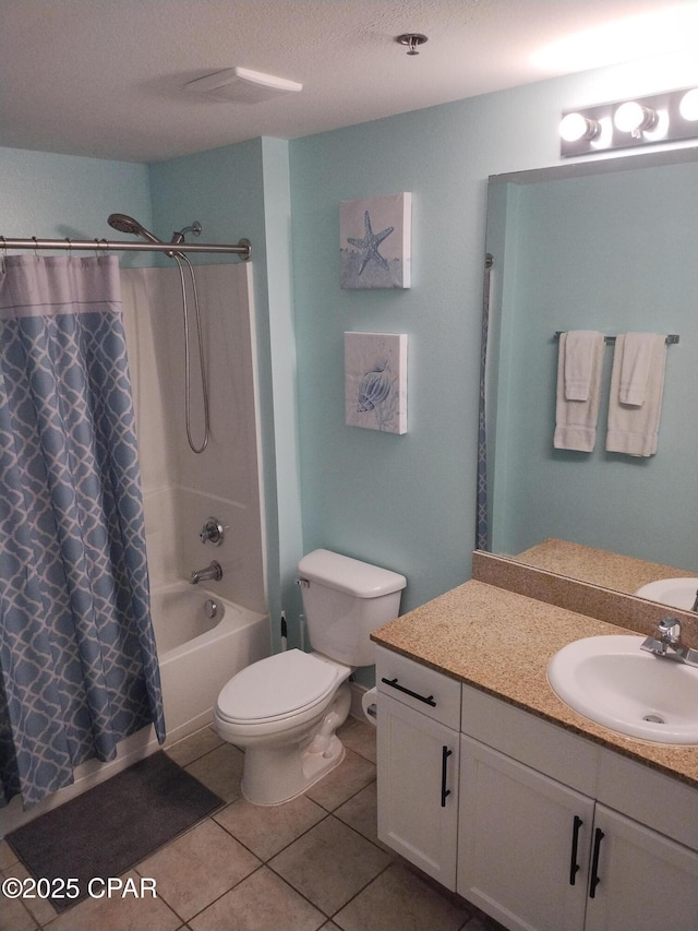 full bathroom with shower / tub combo, toilet, tile patterned flooring, a textured ceiling, and vanity