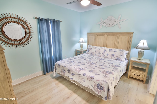 bedroom featuring light wood-style flooring, baseboards, and ceiling fan