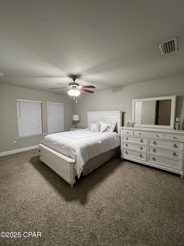 bedroom with a ceiling fan, carpet, visible vents, and baseboards